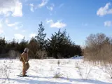 Person walking on a trail in winter