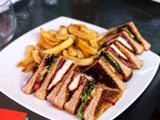 A plate of sandwiches and fries